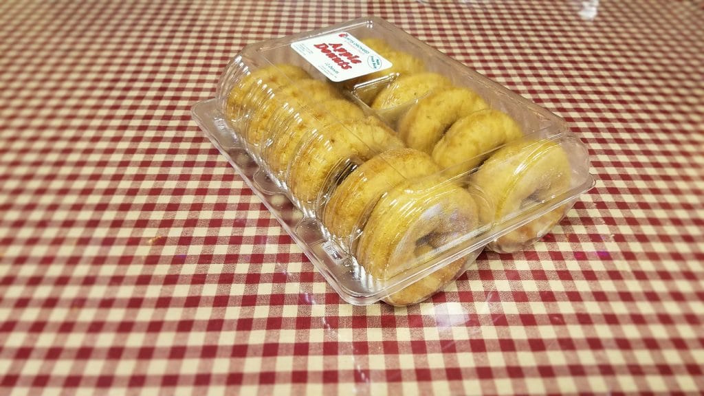 1 dozen apple crisp donuts in a plastic shell