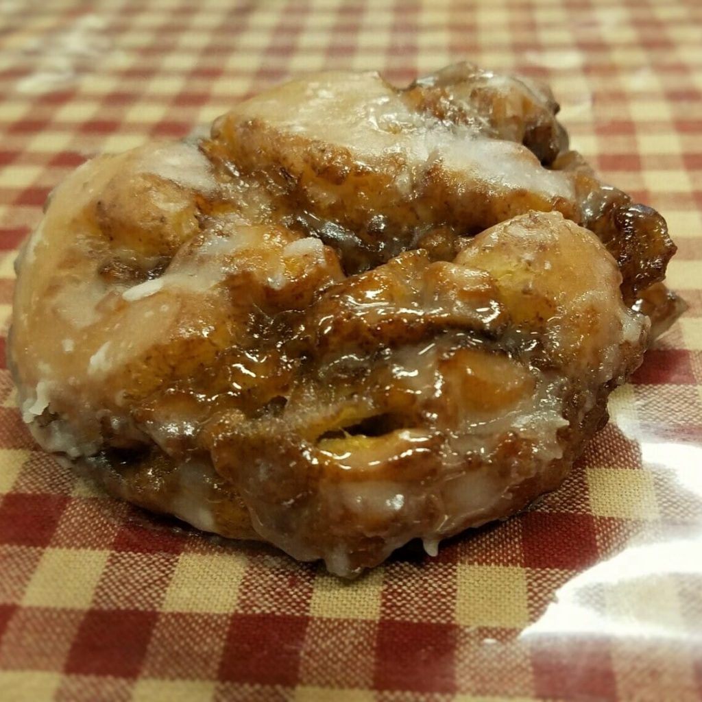Apple fritter placed on a table