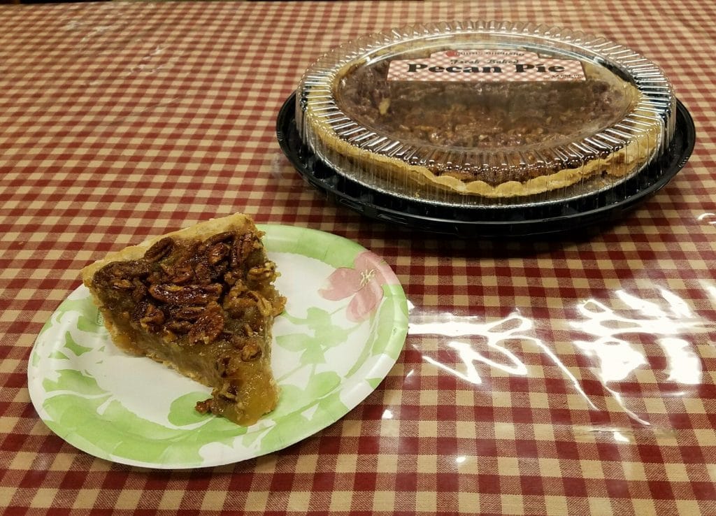Image of a slice of pecan pie.