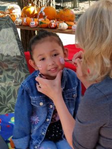 Image of child getting face painted
